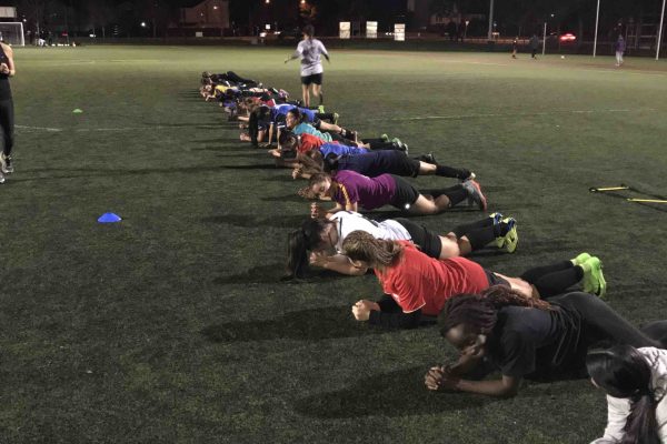 A group of women working out together in a group fitness session at Misfit PT & Fitness