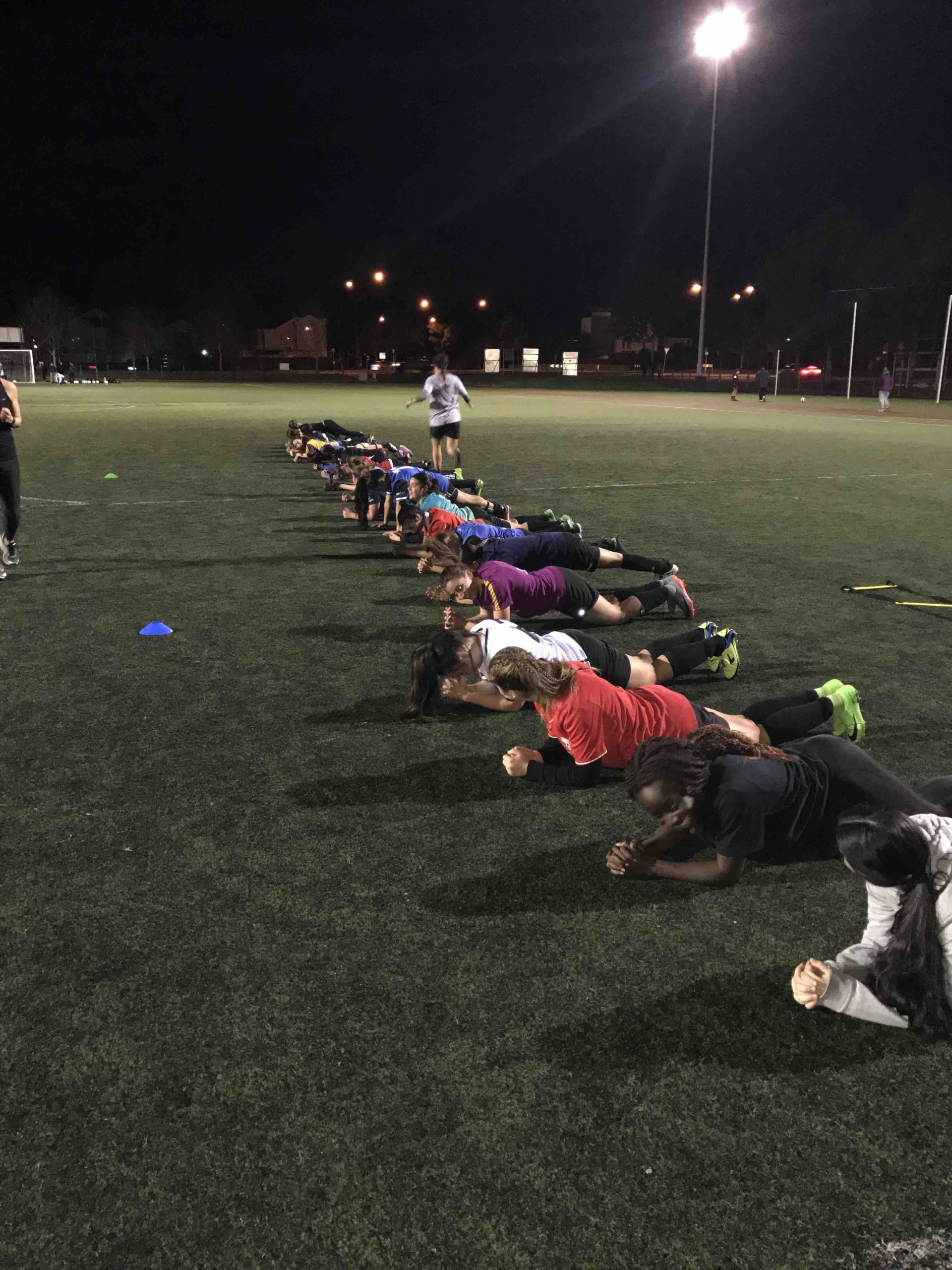 A group of women working out together in a group fitness session at Misfit PT & Fitness